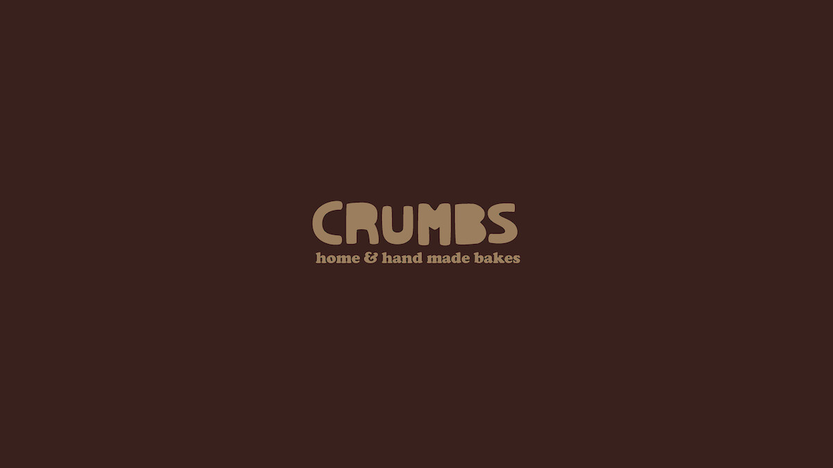 Crumbs bakery logo. Hand-drawn text based on cookie cutter letters.