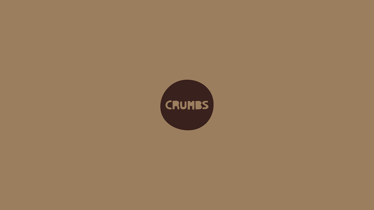 Crumbs bakery logo. Hand-drawn text based on cookie cutter letters.